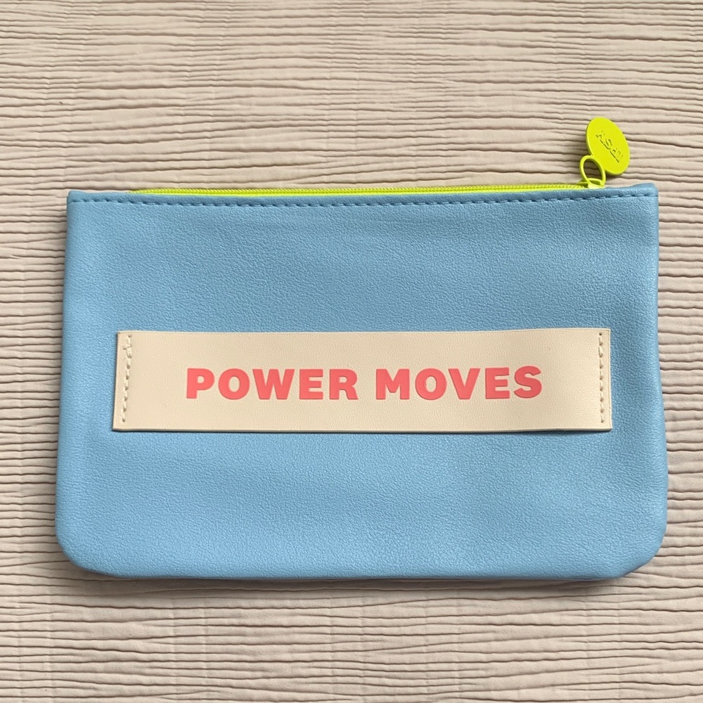 New IPSY Blue cosmetic bag with 'Power Moves' Print.